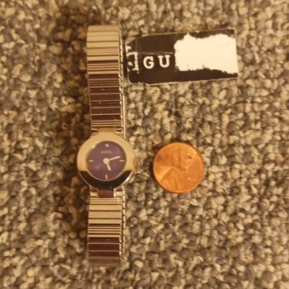 Guess stretch band purple circle dial silver tone women's watch
